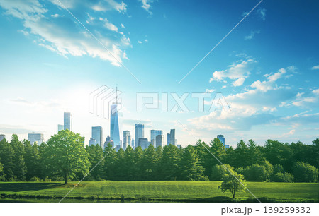 A skyline shows tall buildings against the blue sky. Green trees and grass fill the park area below. Sunshine brightens the scene in the morning. A skyline shows tall buildings against the blue sky. Green trees and grass fill the park area below. Sunshine brightens the scene in the morning. 139259332