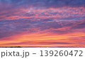 Soft pastel sunset sky with layered colorful clouds background 139260472