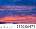 Beautiful Dramatic Sunset Sky with Vibrant Orange Pink and Blue Clouds 139260473