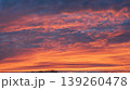 Vivid orange and pink sunset sky with dramatic textured clouds 139260478