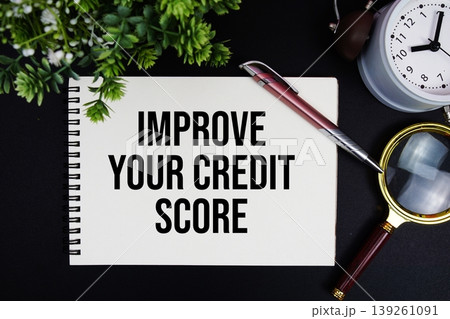 Improve Your Credit Score text with alarm clock and magnifying glass Improve Your Credit Score text with alarm clock and magnifying glass 139261091