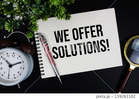 We Offer Solutions! text with alarm clock and magnifying glass We Offer Solutions! text with alarm clock and magnifying glass 139261102