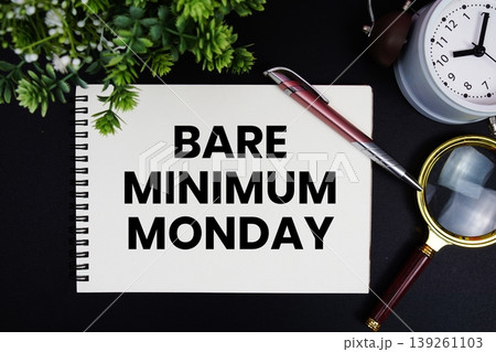 Bare Minimum Monday text with alarm clock and magnifying glass Bare Minimum Monday text with alarm clock and magnifying glass 139261103