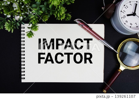 Impact Factor text with alarm clock and magnifying glass Impact Factor text with alarm clock and magnifying glass 139261107