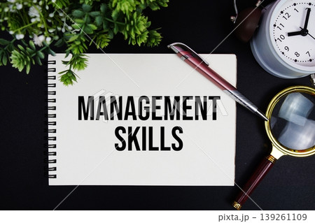 Management Skills text with alarm clock and magnifying glass Management Skills text with alarm clock and magnifying glass 139261109