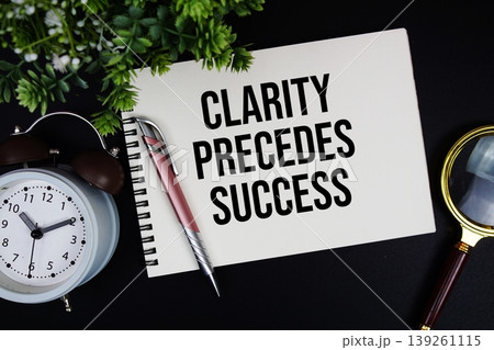 Clarity Precedes Success text with alarm clock and magnifying glass Clarity Precedes Success text with alarm clock and magnifying glass 139261115