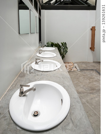 Modern Restroom with Concrete Countertop Sinks Modern Restroom with Concrete Countertop Sinks 139261631