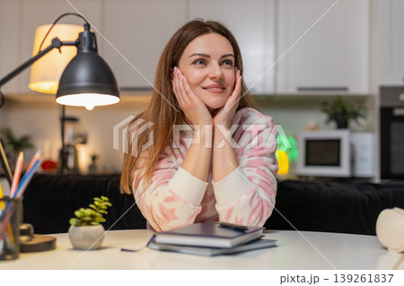 Adult woman freelancer at night seeks idea inspiration thinks plans weekend creative focus calm hope 139261837