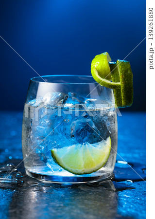 Vodka with lime and ice cubes in a fogged up glass. 139261880