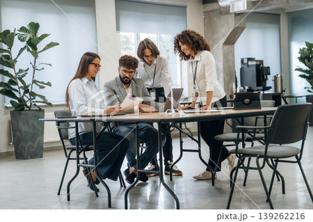 Table with laptops. Group of people are working in the office together as a team 139262216