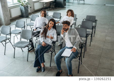 Listening to the presentation. People are sitting on the meeting, business conception 139262251