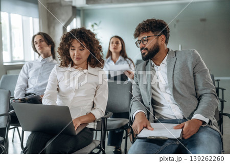 People are sitting on the meeting, education presentation, business conception People are sitting on the meeting, education presentation, business conception 139262260