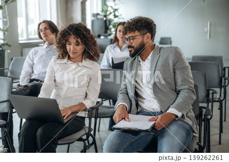 People are sitting on the meeting, education presentation, business conception People are sitting on the meeting, education presentation, business conception 139262261