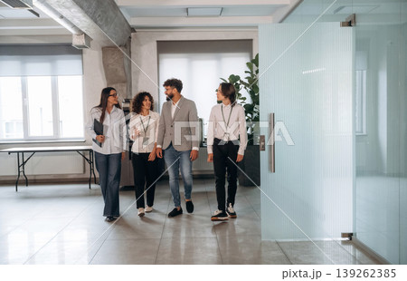 In the hall. Four office workers are together, employees at work 139262385