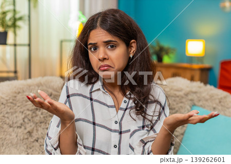 Indian woman gestures seriously looking at camera frustration disbelief angry expression indoor mood 139262601