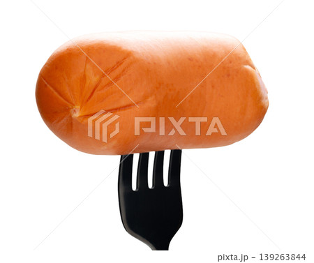 Appetizing sausage on a fork, isolated on white background 139263844