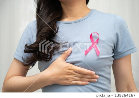 Asian woman with pink ribbon, World Breast Cancer Day at October. Asian woman with pink ribbon, World Breast Cancer Day at October. 139264167