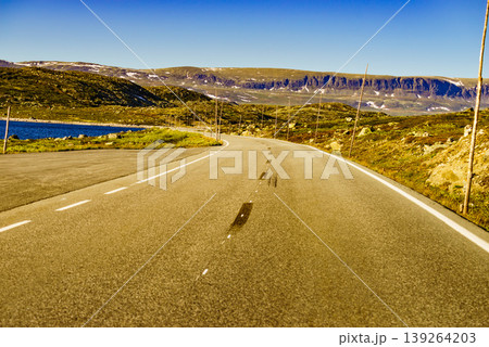 Road crossing Hardangervidda plateau, Norway 139264203