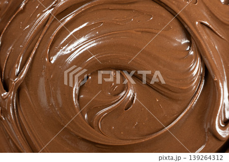 Creamy delicious chocolate melted cream texture background top view Creamy delicious chocolate melted cream texture background top view 139264312