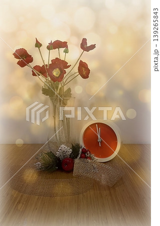 New Year Countdown Still Life with Clock and Red Flowers. A festive scene featuring a modern red clock at five minutes to midnight, paired with red poppies and winter decor. New Year Countdown Still Life with Clock and Red Flowers. A festive scene featuring a modern red clock at five minutes to midnight, paired with red poppies and winter decor. 139265843
