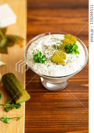 Homemade healthy dip with pickles garlic and creamy texture Homemade healthy dip with pickles garlic and creamy texture 139266511