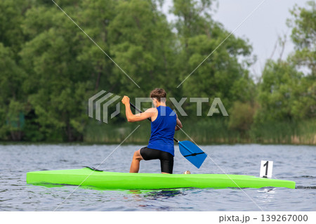 Young athlete canoeist paddling Young athlete canoeist paddling 139267000