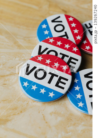cluster of vote badges on a marble surface cluster of vote badges on a marble surface 139267240
