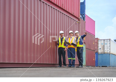 Asian Port Authorities Inspecting Large Red Shipping Container for Global Trade Logistics and Supply Chain Management Asian Port Authorities Inspecting Large Red Shipping Container for Global Trade Logistics and Supply Chain Management 139267923