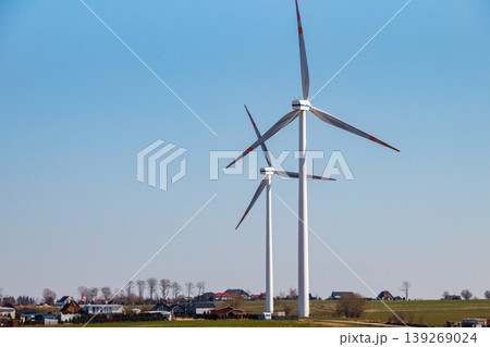 Wind turbines in a village. Renewable energy Wind turbines in a village. Renewable energy 139269024