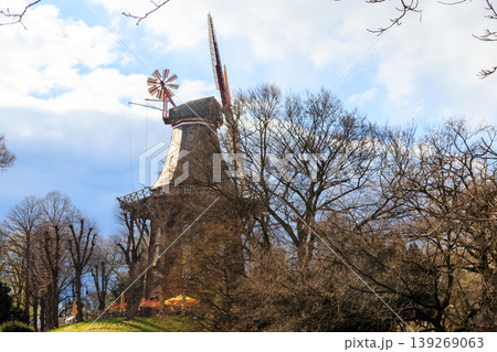 Old wooden windmill in park in Bremen, Germany Old wooden windmill in park in Bremen, Germany 139269063