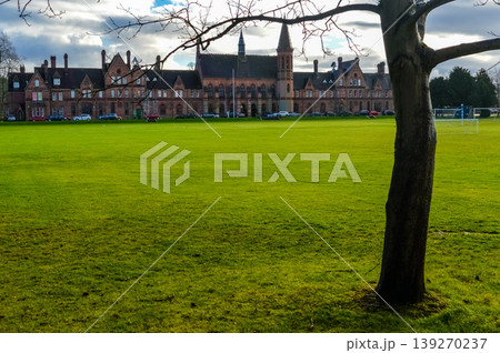 Historic building with green field Oxford England. 139270237