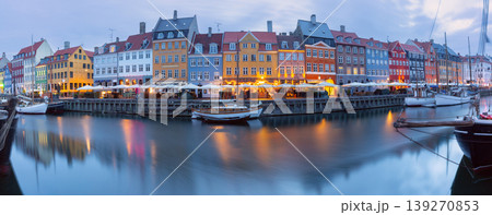 Nyhavn canal waterfront with moored boats at dawn in Copenhagen Denmark Nyhavn canal waterfront with moored boats at dawn in Copenhagen Denmark 139270853