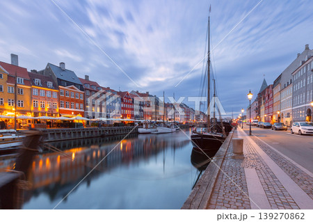 Nyhavn canal waterfront with moored boats at dawn in Copenhagen Denmark 139270862