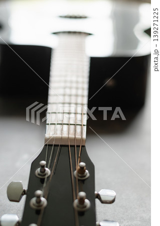 Acoustic guitar neck close up strings music concept Acoustic guitar neck close up strings music concept 139271225