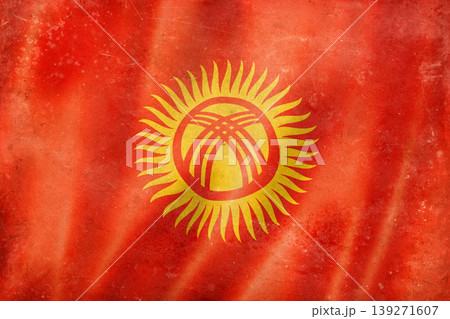 Old vintage flag of Kyrgyzstan, worn and stained Old vintage flag of Kyrgyzstan, worn and stained 139271607