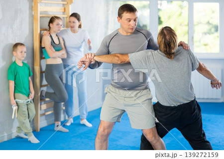 Man in gym perform basic elements of krav maga self-defense system. Man in gym perform basic elements of krav maga self-defense system. 139272159