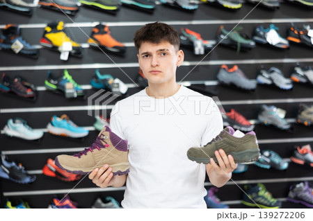 Guy choose summer shoes for hiking 139272206