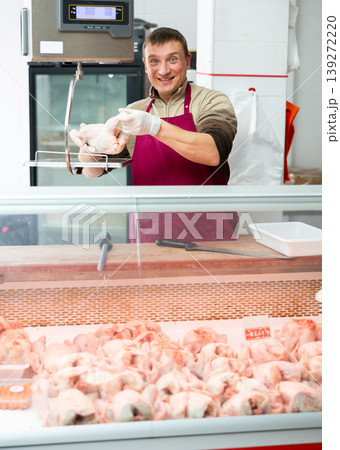 Positive seller offers to buy chicken carcasses in grocery store 139272220
