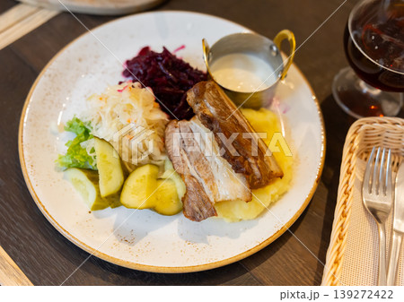 Baked pork breast with horseradish according to a Lithuanian recipe Baked pork breast with horseradish according to a Lithuanian recipe 139272422