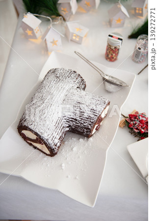 new Year's, chocolate cake in the form of a log. new Year's, chocolate cake in the form of a log. 139272771