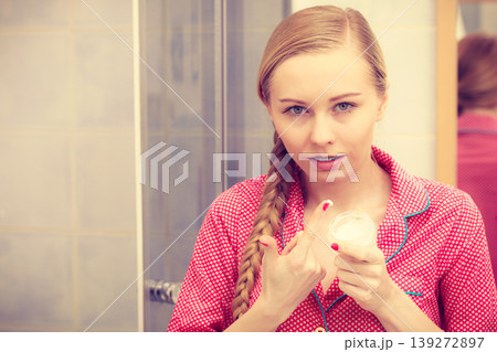 Woman applying moisturizing skin cream. Skincare. 139272897