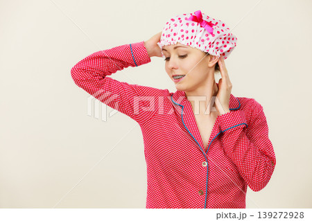 Funny woman wearing pajamas and bathing cap Funny woman wearing pajamas and bathing cap 139272928