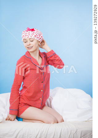 Funny woman wearing pajamas and bathing cap Funny woman wearing pajamas and bathing cap 139272929