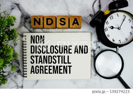 NDSA National Digital Stewardship Alliance text with alarm clock and magnifying glass on marble background 139274223