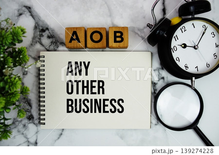 AOB Any Other Business text with alarm clock and magnifying glass on marble background AOB Any Other Business text with alarm clock and magnifying glass on marble background 139274228