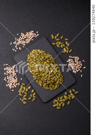 Shelled pumpkin seed kernels, salted, roasted, or raw, are a healthy ingredient. Pumpkin seeds 139274640