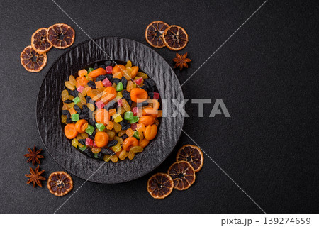 Dried apricots, raisins, and candied fruits as ingredients for baked goods and sweets. Dried fruits 139274659