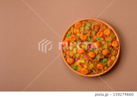 Dried apricots, raisins, and candied fruits as ingredients for baked goods and sweets. Dried fruits Dried apricots, raisins, and candied fruits as ingredients for baked goods and sweets. Dried fruits 139274660