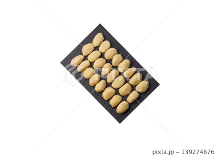Raw homemade potato gnocchi, made with salt and spices, ready for lunch. Raw gnocchi 139274676