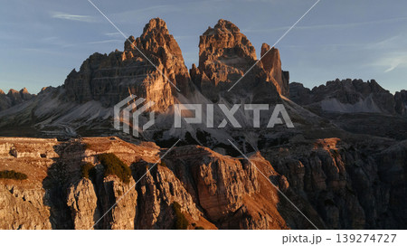 The sunlight covers the rocks. Tre Cime di Lavaredo mountains, majestic view of the popular place, nature background The sunlight covers the rocks. Tre Cime di Lavaredo mountains, majestic view of the popular place, nature background 139274727